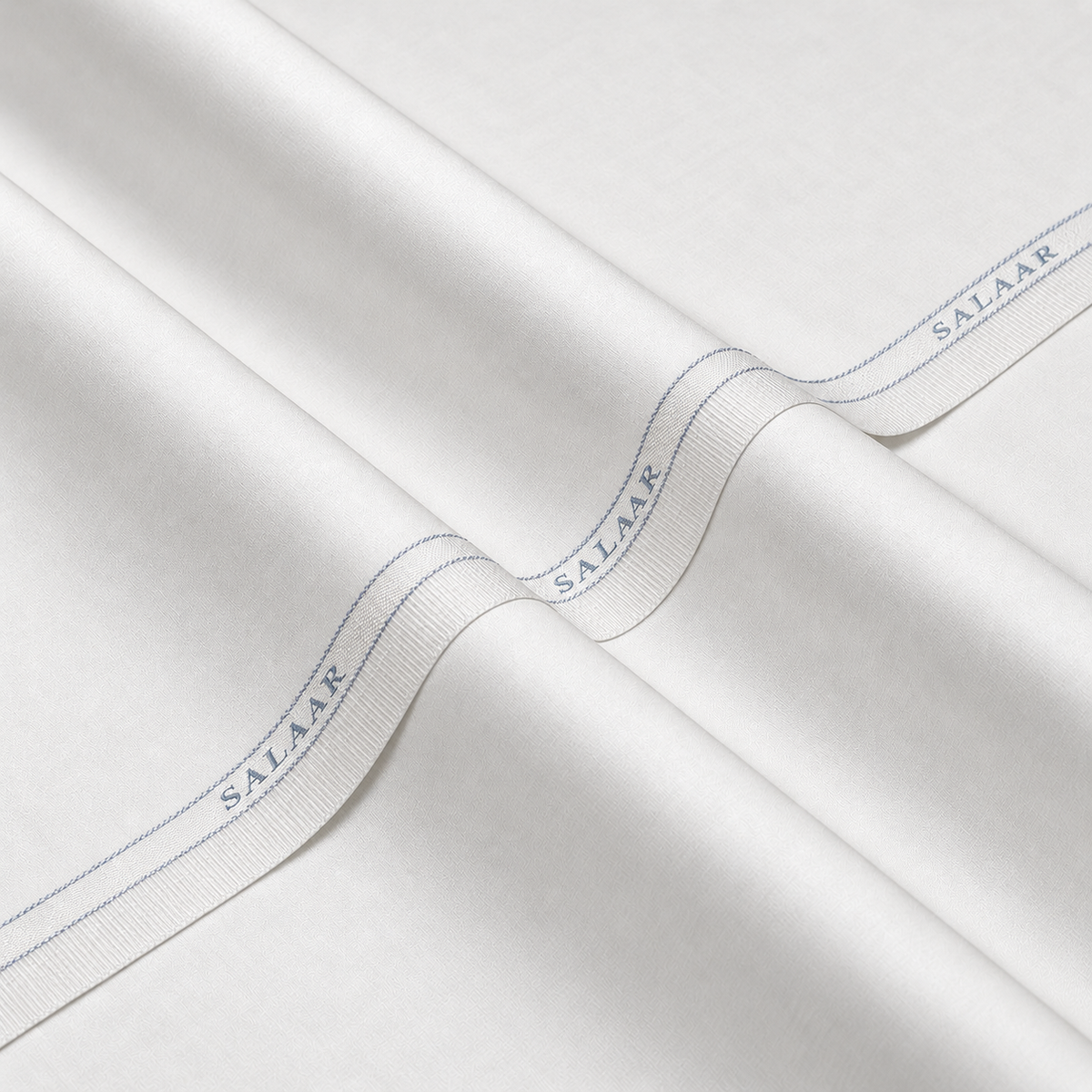 SALAAR Alpine White Egyptian Cotton fabric with woven SALAAR selvedge border