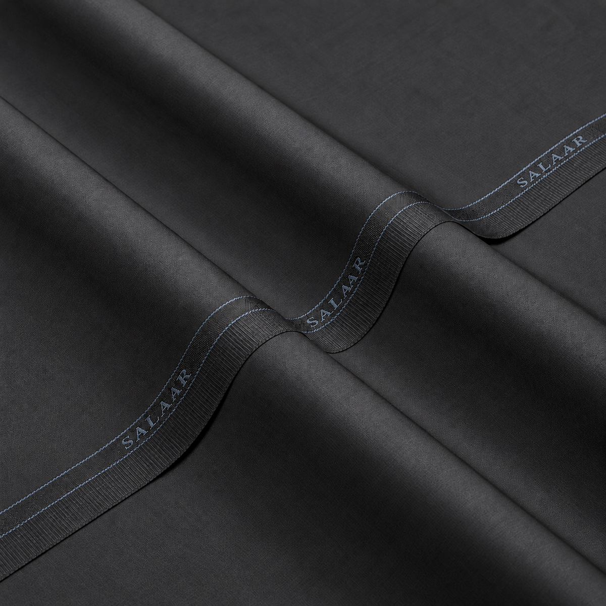 SALAAR Ashford Charcoal Summer Blend fabric with woven SALAAR selvedge border