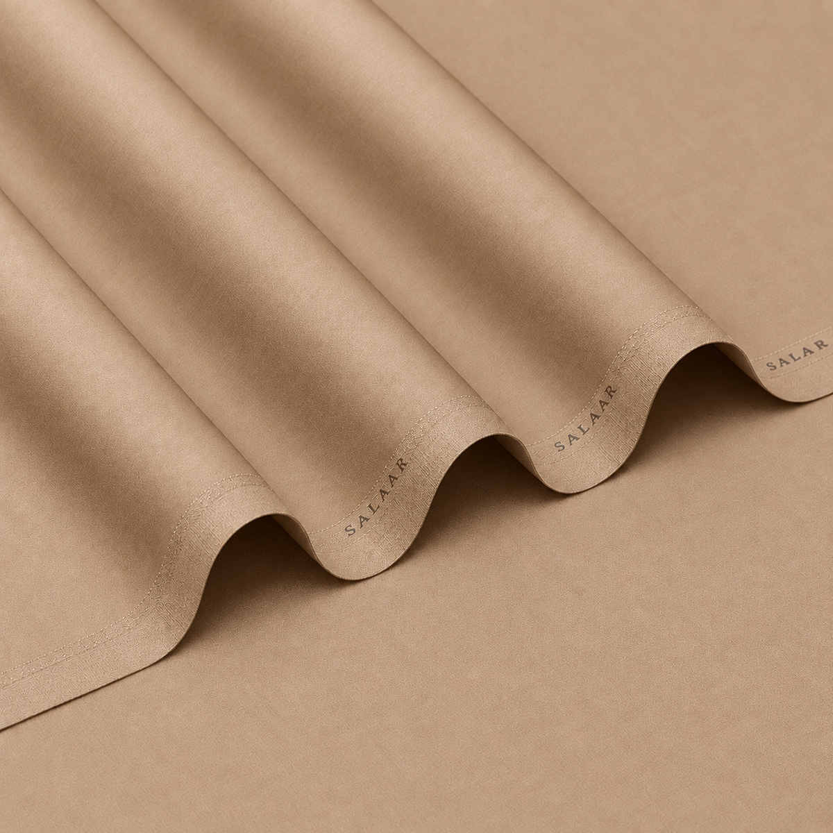 SALAAR Desert Sand Summer Blend fabric with flowing folds and SALAAR woven border