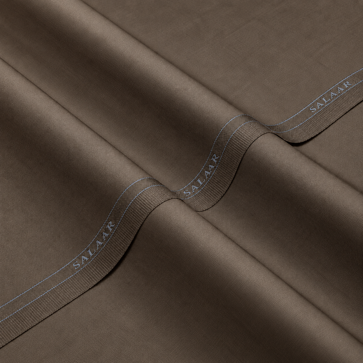 SALAAR Imperial Taupe Summer Blend fabric with woven SALAAR selvedge border