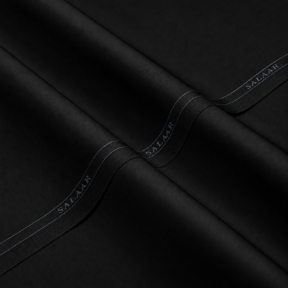 SALAAR Obsidian Black Signature Blend fabric with woven SALAAR selvedge border