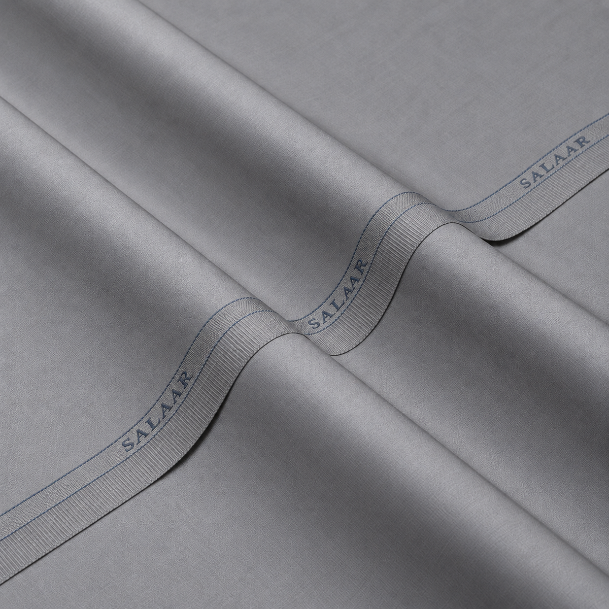 SALAAR Pearl Smoke Signature Blend fabric with woven SALAAR selvedge border