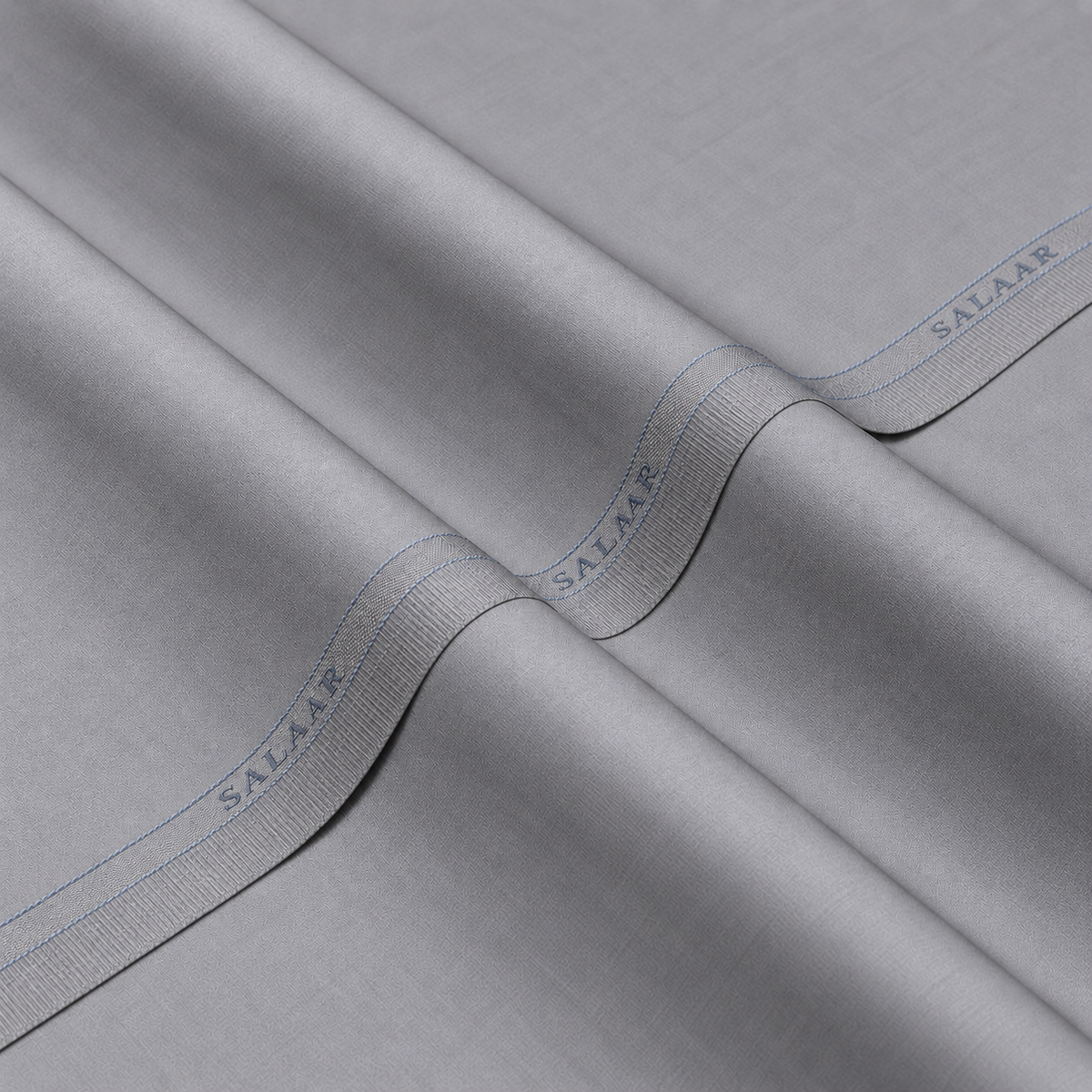 SALAAR Silver Mist Summer Blend fabric with woven SALAAR selvedge border