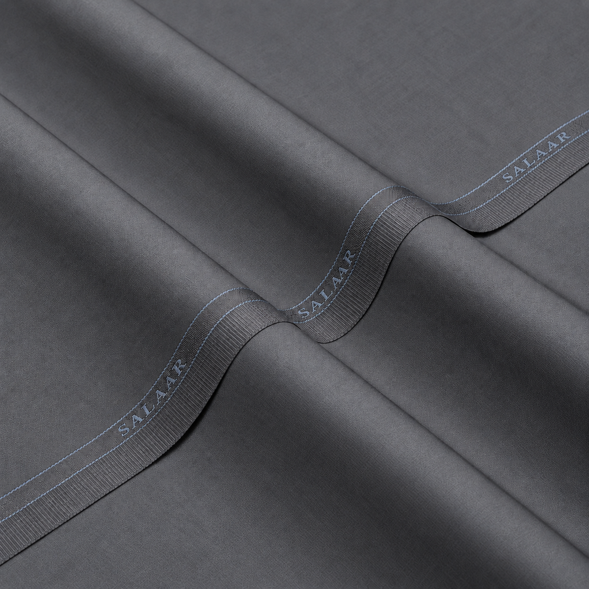 SALAAR Sterling Grey Summer Blend fabric with woven SALAAR selvedge border